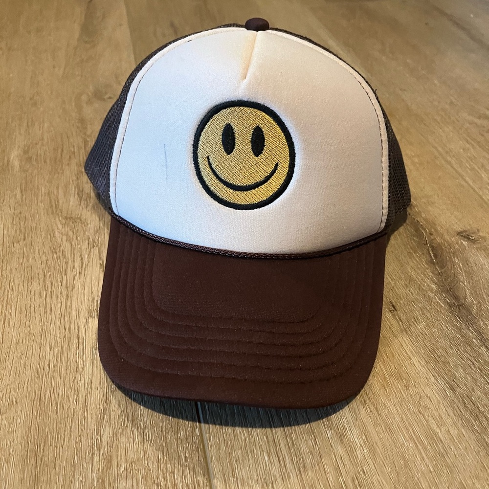 Brown and yellow snap back smile hat